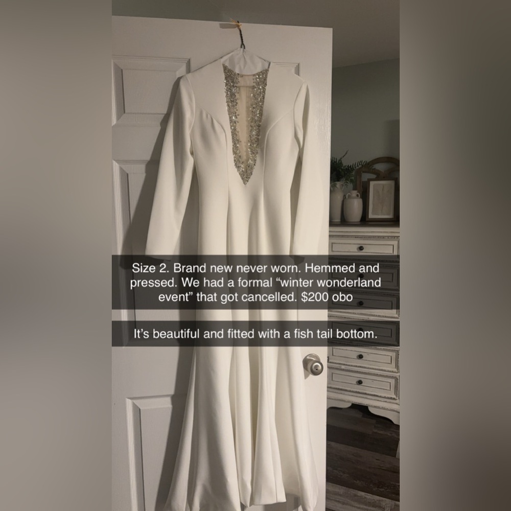White formal gown
Mesh w rhinestones cut out
Flared bottom